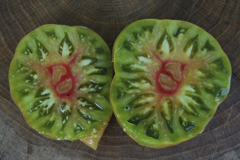 Description of tomatoes of the Pineapple variety: features of their cultivation in open and closed ground