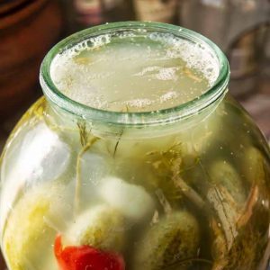 Why does a white bloom appear on pickled cucumbers and is it possible to eat them