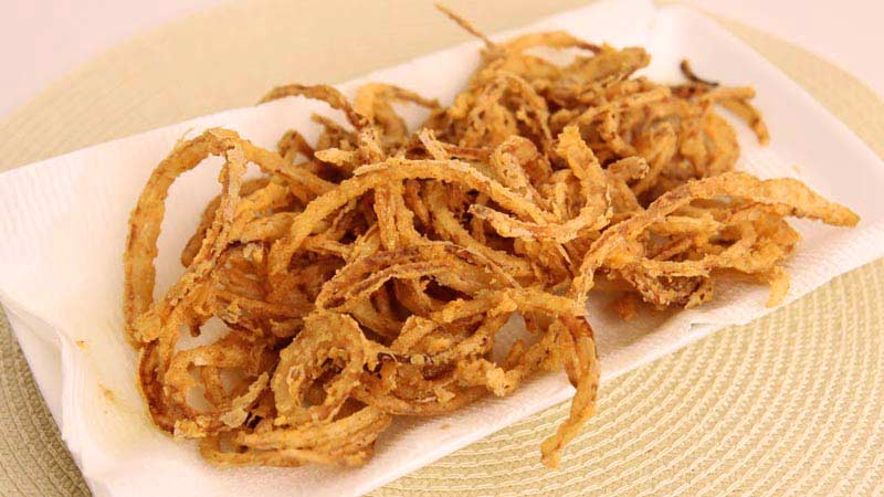 Is it possible to eat fried onions while losing weight and what is its calorie content