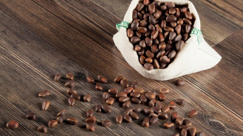 Why are pine nuts useful for women?