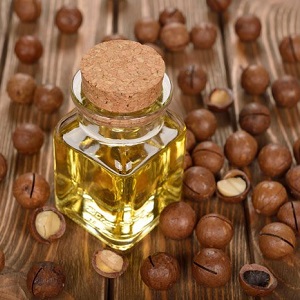 Where and how does macadamia nut grow and how is it used