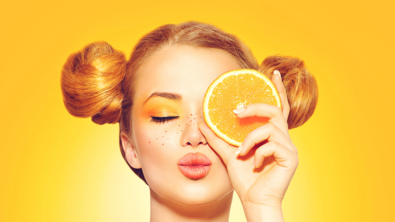 Woman and oranges - benefit and harm