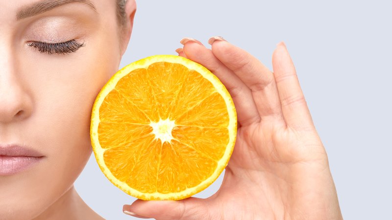 Woman and oranges - benefit and harm