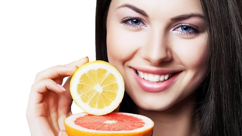Woman and oranges - benefit and harm